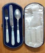 A set of silver mounts and motherpearl handles of knife, fork and spoon, cased in a refined