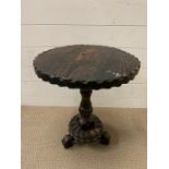 An oak low side table with craved centre support (H52cm Dia44cm)