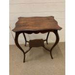 A mahogany side table with scalloped edge and under tier (H72cm W58cm D40cm)