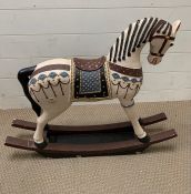 A plater rocking horse (H65cm W77cm)