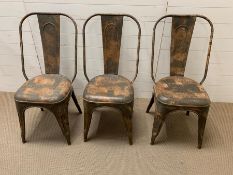 Three steel frame Mid Century chairs in the style of Jean Pauchard