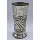 A silver vase with foliate design, hallmarked for London 1889 by F B Thomas & Co (Total Weight