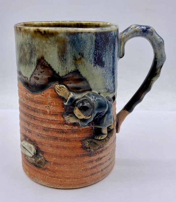 An Oriental studio mug depicting a man.