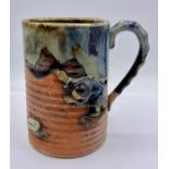 An Oriental studio mug depicting a man.
