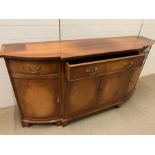 A mahogany sideboard with string inlaid and brass handles (H88cm W169cm D42cm)