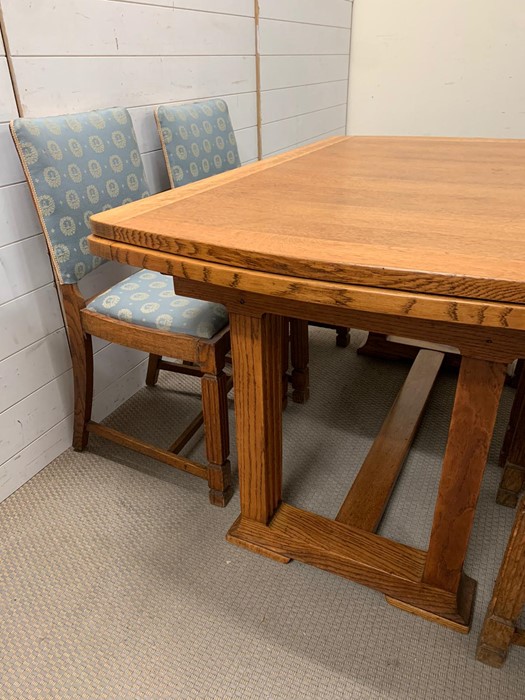 An oak table with reeded legs, extends both sides and four matching chairs (H77cm W126cm D84cm) - Image 4 of 4