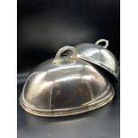Two silver plate serving cloches (Sizes 36cm x 28cm x 26cm H and 18cm H x 26cm x 20cm)