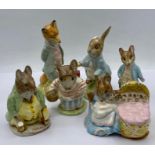 A collection of Beatrix Potter figures made by Beswick