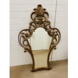 A continental style giltwood/composition wall mirror with scrolls to top and sides H153cm x W94cm