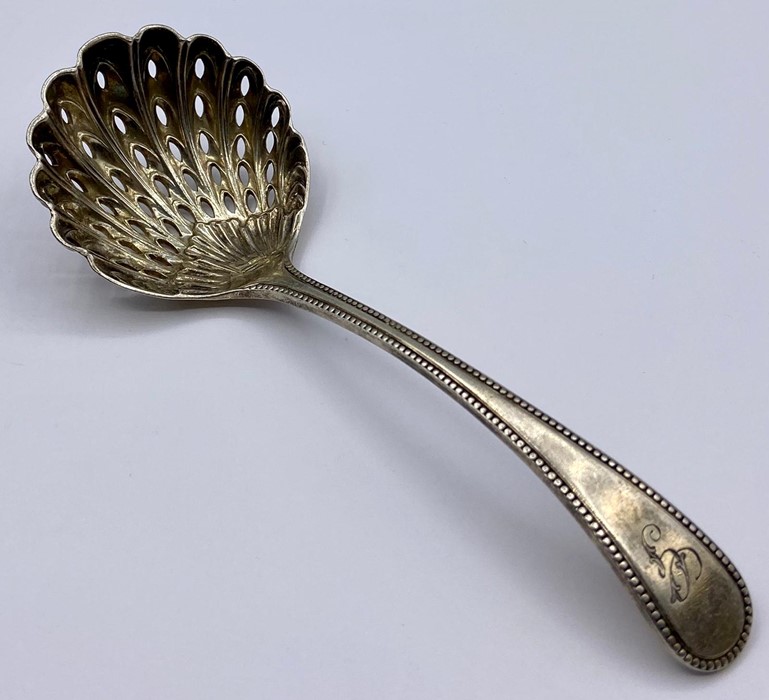 A silver sugar sifter, Sheffield hallmark by Joseph Rodgers & Sons