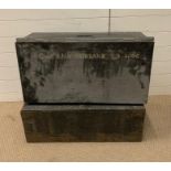 Two military trunks, one metal with the words Capt.R.N.V Fairbank TD HAC and one wooden with handles