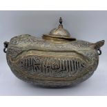 An Antique heavily engraved Persian camel flask.