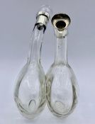 A Silver topped oil and vinegar pourer