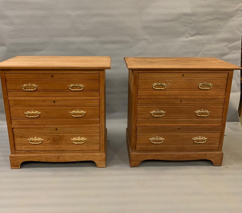 A pair of pine chest of three drawers on bracket feet (H84cm W84cm D50cm)