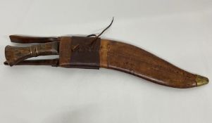 A Kukri with marks to blade Co I I GII 1917 37 in leather sheath, military mark.