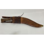 A Kukri with marks to blade Co I I GII 1917 37 in leather sheath, military mark.