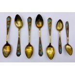 A selection of Russian enamelled teaspoons spoons five larger, two smaller marked 875.