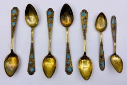 A selection of Russian enamelled teaspoons spoons five larger, two smaller marked 875.