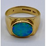 An Opal ring in a contemporary 9ct gold setting (4g) Size L & 1/2