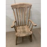 A Victorian beech and fruitwood slat back armchair