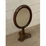 A mahogany vanity mirror