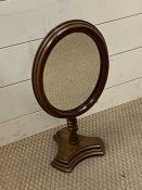 A mahogany vanity mirror