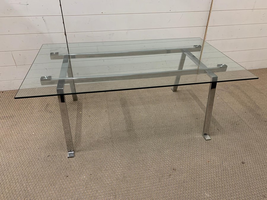 A glass and chrome coffee table (H46cm W120cm 72cm)