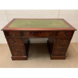 A reproduction mahogany pedestal desk by Charles Barr with rectangular leather insert and an