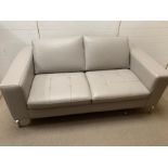 A two seater Natuzzi grey leather upholstered sofa (H77cm W172cm D93cm SH43cm)