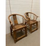A pair of Chinese elm wedding chairs with horse shoe back and carved splat (H90cm W65cm D35cm)