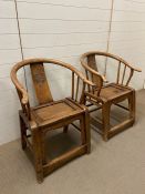 A pair of Chinese elm wedding chairs with horse shoe back and carved splat (H90cm W65cm D35cm)