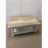 A distressed coffee table with plank top ad solid wooden base (H57cm W134cm D100cm)