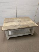 A distressed coffee table with plank top ad solid wooden base (H57cm W134cm D100cm)