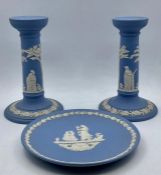 A group of vintage wedgwood ‘light blue’ jasper ware comprising of a pair of candlesticks and a