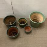 Five glazed garden pots various sizes