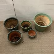 Five glazed garden pots various sizes