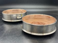 A Pair of hallmarked silver wine coasters, London hallmark, makers mark MCH