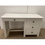 A white desk with three drawers to right hand side and one drawer over knee hole (H76cm W130cm