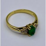 A 9ct emerald and diamond style fashion ring