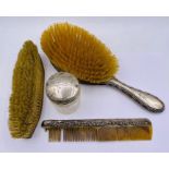 A selection of silver items to included lidded pot, brushes and comb