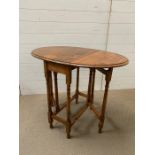 A small drop side occasional table (H74cm W90cm)