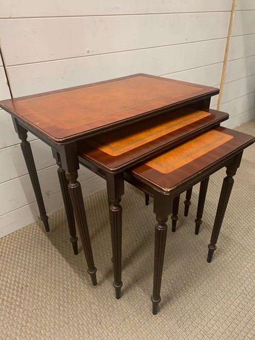 A nest of three tables with reeded legs and leather top (56cm x 36cm largest) - Image 3 of 3