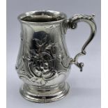 A Victorian ornate silver tankard Hallmarked London 1869 RH makers mark, Robert Harper.(Total Weight