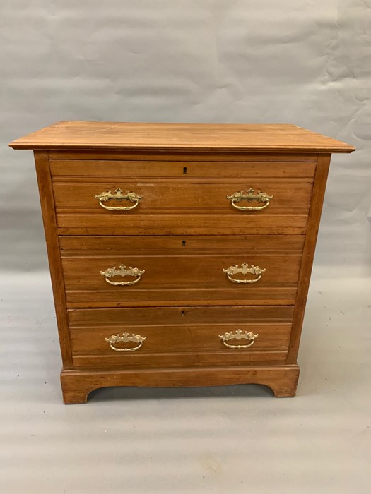 A pair of pine chest of three drawers on bracket feet (H84cm W84cm D50cm) - Image 2 of 4