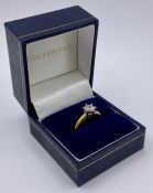 A Diamond 18ct gold engagement ring in original box with a Goldsmiths Bear.
