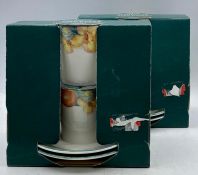 Two boxed sets of two coffee cups and saucers made by Millbrook fine china