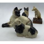 A vintage Siamese cat by Beswick and three more porcelain pets, (12x19 cm cat). (4)