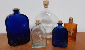 A collection of five empty glass bottles, (21.5 cm largest). (5)