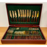 A brass and rosewood cutlery box