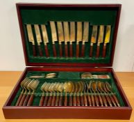 A brass and rosewood cutlery box